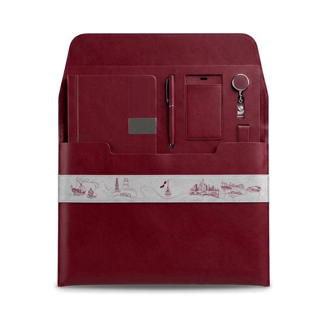 The open folio with notebook, pen, ID holder and badge reel seated in their pockets.